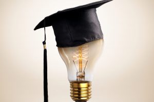 congratulations graduates cap on a lamp bulb, concept of educati